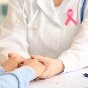 Young woman visiting doctor in clinic, closeup