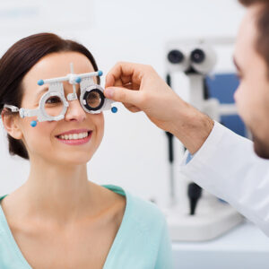 optician with trial frame and patient at clinic